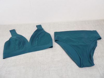 the two pieces of underwear are laying on the bed