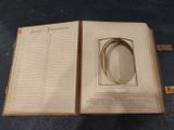 an open book with a picture inside of it on a table
