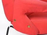 an image of a red chair with black legs and a black base