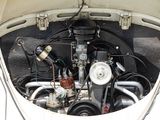 a car engine in the trunk of a white car