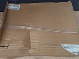 a cardboard box that has a piece of paper in it
