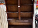 an image of a wooden bookcase in a store