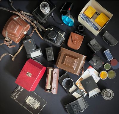 many different types of cameras on the table