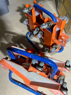 pair of orange and blue jacks sitting on top of a wooden floor