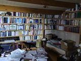 a room with a lot of books on the shelves