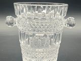 a glass vase that is sitting on a table