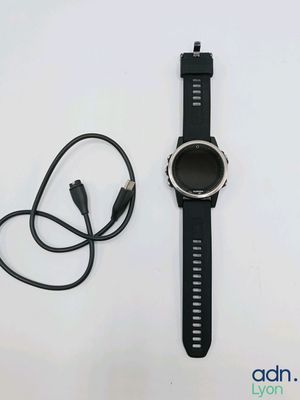 a smart watch with a charger attached to it