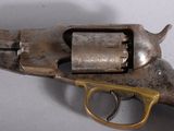 an old gun that is sitting on a table
