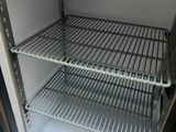a small refrigerator with a lot of shelves in it
