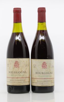 two bottles of red wine sitting next to each other on a white surface