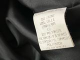 a close up of a label on a black dress