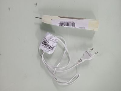a white cord that is connected to a charger on a table