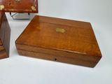 two wooden boxes sitting next to each other on a table