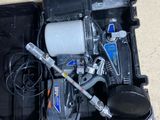 a black box with a pump and other tools in it