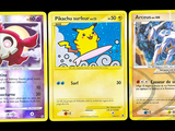 three pokemon cards are shown in a row on a black background