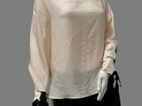 an image of a mannequin mannequin wearing a white top and black pants