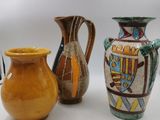 three vases sitting next to each other on a table