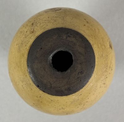a close up of a vase with a hole in it