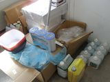 a room with a lot of boxes and containers