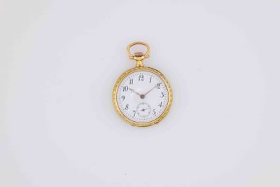 an antique pocket watch on a white surface with a white background