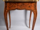 an image of a small table with a wooden top and legs
