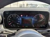 the dashboard of a car with a digital display on it