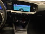 a picture of a car dashboard with a car game on the screen