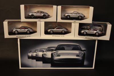 six different models of porsches in a box