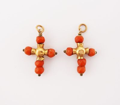 a pair of coral and gold earrings