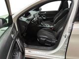 the interior of a car with the door open and the driver ' s seat down