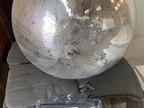 a disco ball sitting on top of a chair in a room
