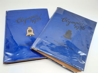 two blue book covers with gold lettering and a bell on them