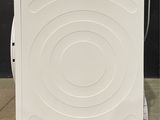 an image of a white dishwasher sitting on the floor