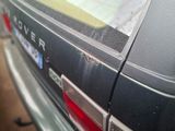 a close up of a car that has been dented