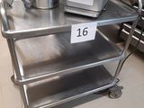 a metal cart with a mixer on it in a kitchen