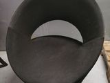 a black chair that is sitting in a room