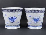 pair of blue and white vases with floral designs on them