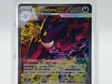 a close up of a pokemon card in a plastic case