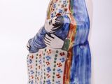 pair of ceramic figurines of a woman and a man