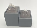 two rings in a display box with a ring on top of it
