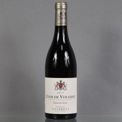 a bottle of red wine sitting on top of a table