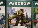 several cards of warcraw are on display in a store