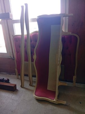 three chairs that are sitting in a room with a window