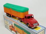 a toy truck that is sitting on top of a box