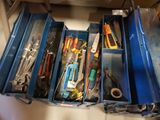 many tools in the blue box on the table