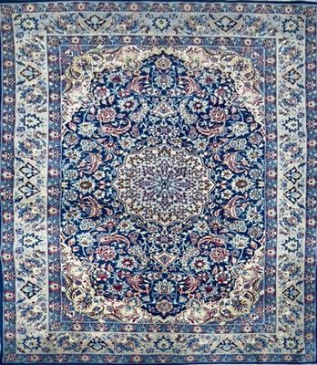 a blue rug with a medallion design on it