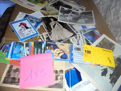 a pile of old photos and post it notes on the floor