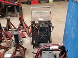 a lot of tools that are on the floor in the garage