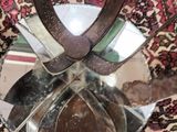 a small table with a mirror on top of it