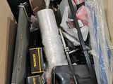 a cardboard box filled with assorted items in it